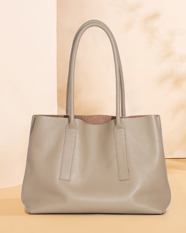 Beige handbag on a beige background