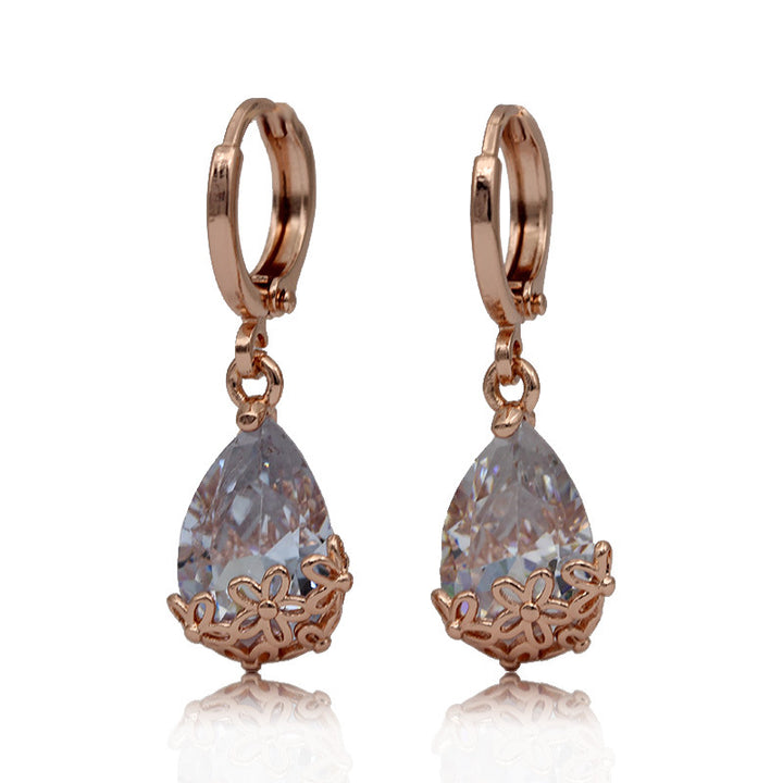 Pendientes asimétricos con diseño de oro rosa