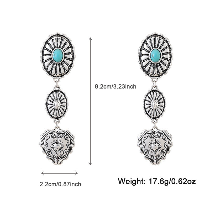 Pair of silver earrings with turquoise stones and heart designs, shown with measurements and weight on a white background.