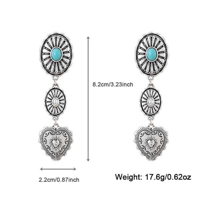 Pair of silver earrings with turquoise stones and heart designs, shown with measurements and weight on a white background.