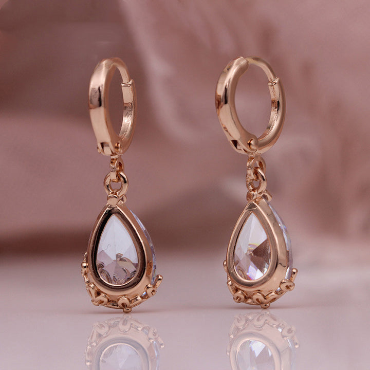 Pendientes asimétricos con diseño de oro rosa