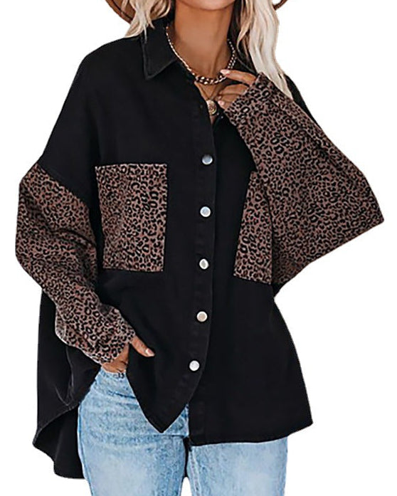 Black shirt with leopard print sleeves and pockets worn by a model on a white background
