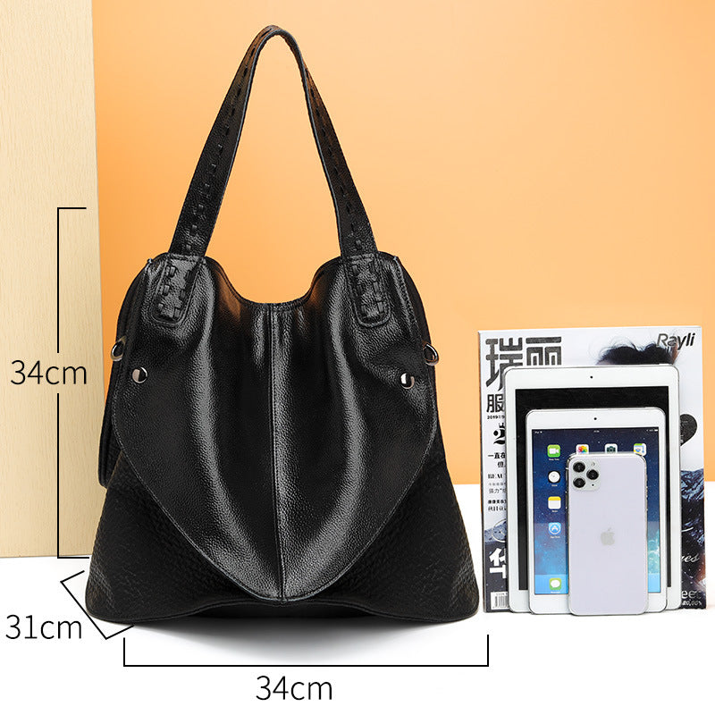 Bolso de mano negro de piel suave informal con carita sonriente