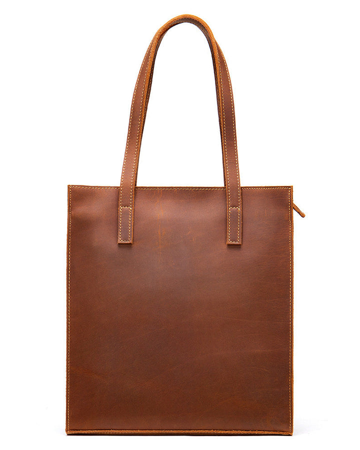 Brown leather tote bag on a white background