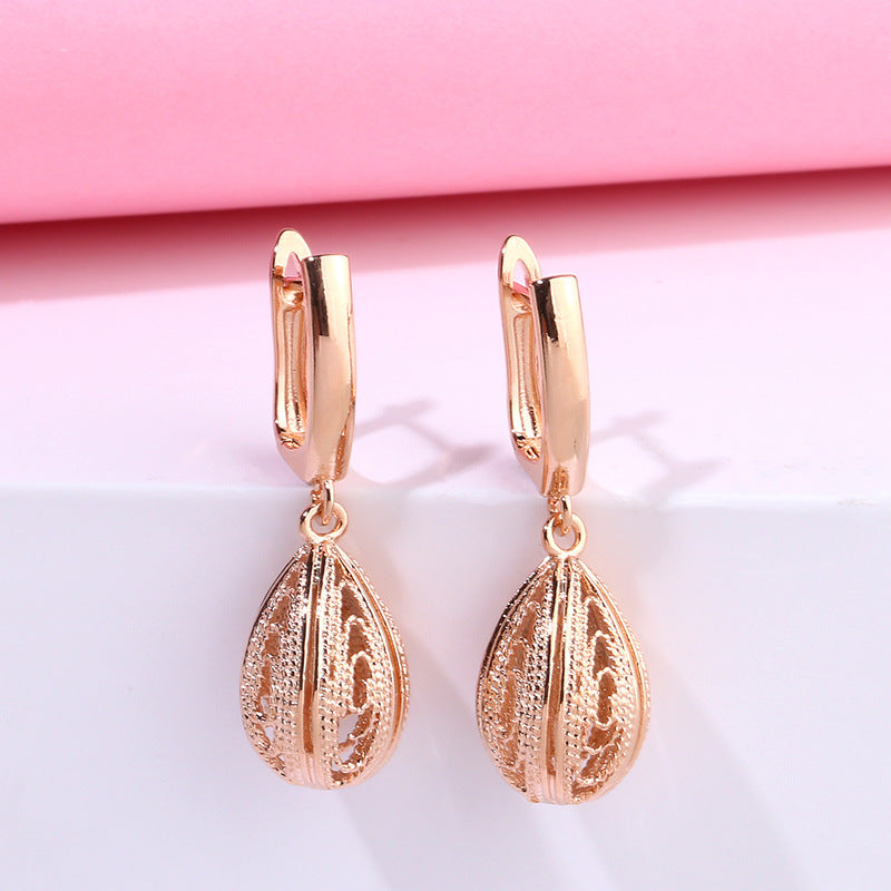 Pendientes de gota de oro rosa creativos