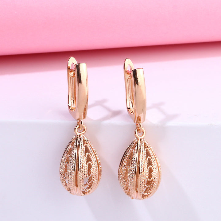 Pendientes de gota de oro rosa creativos
