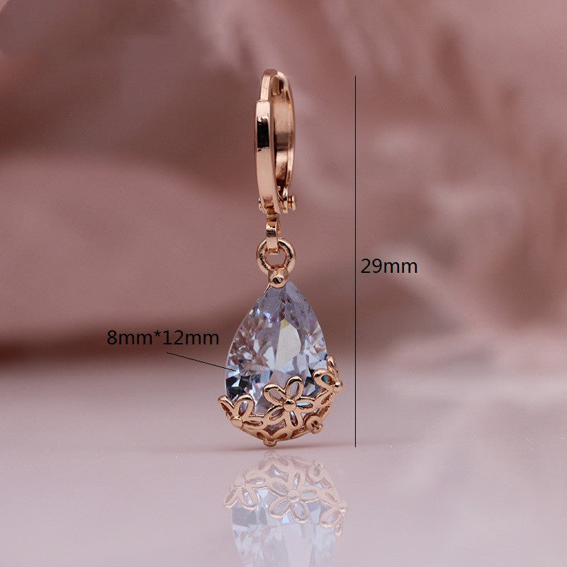 Pendientes asimétricos con diseño de oro rosa