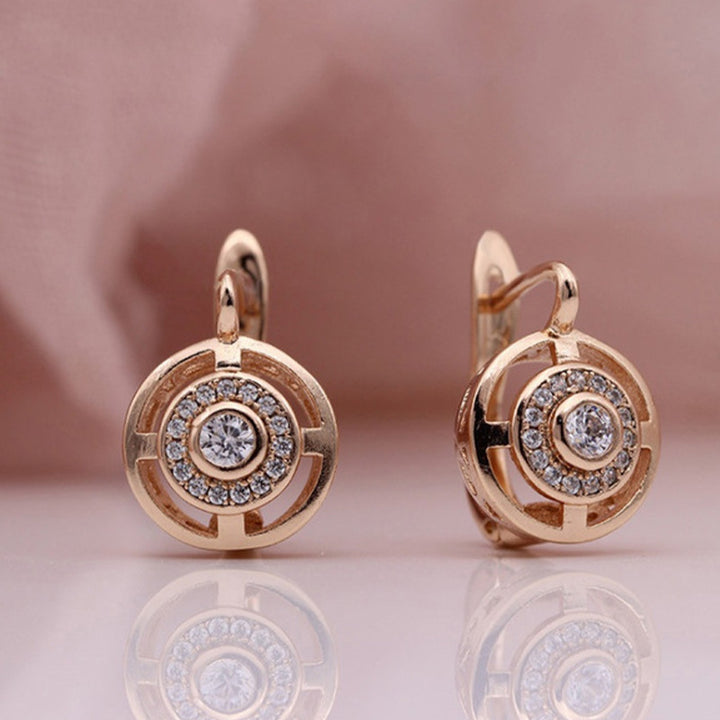 Pendientes redondos de circonitas con microengaste de oro rosa en cobre