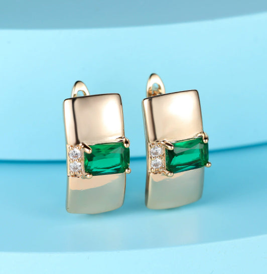 Pendientes de mujer de oro rosa con rosa azul natural y a la moda
