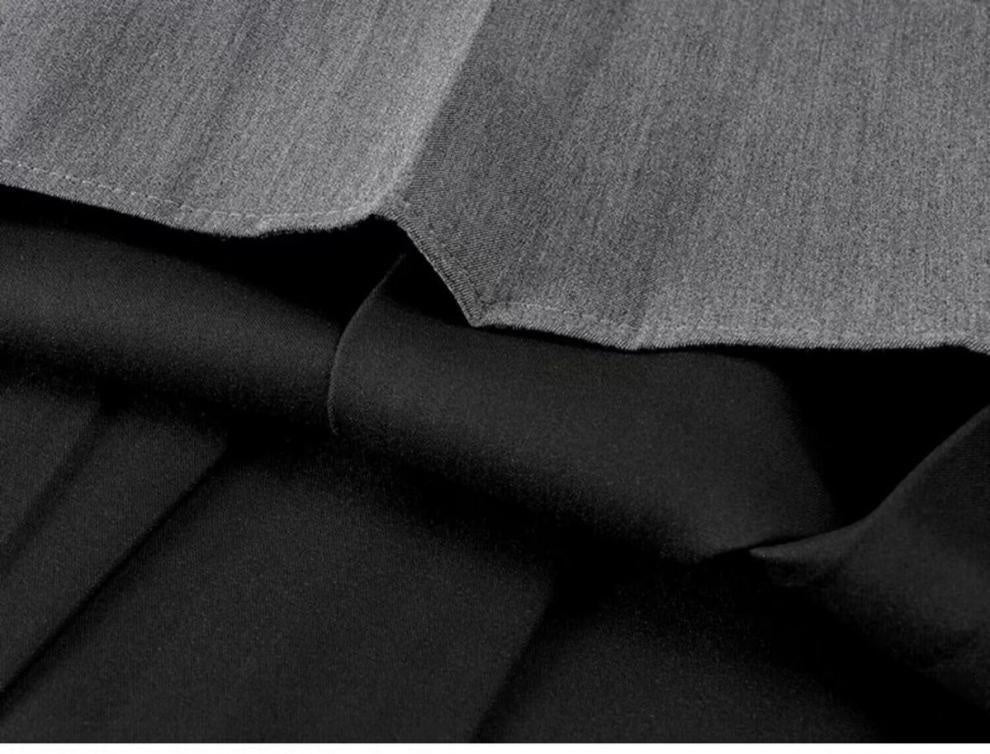 Close-up of black and gray fabric with a textured pattern