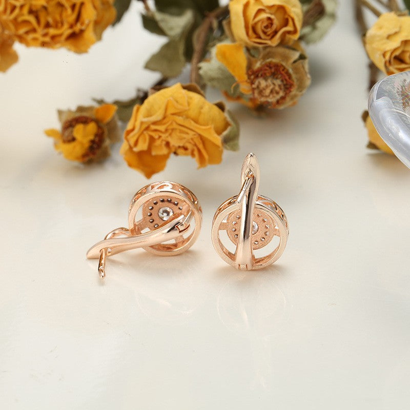 Pendientes redondos de circonitas con microengaste de oro rosa en cobre