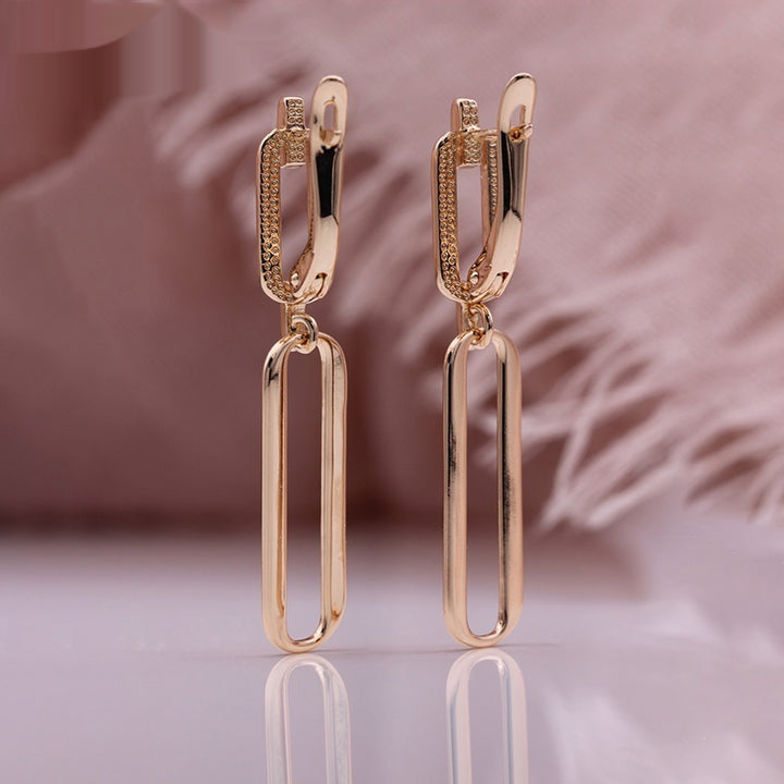 Pendientes largos colgantes de oro rosa huecos con microincrustaciones de circonita natural