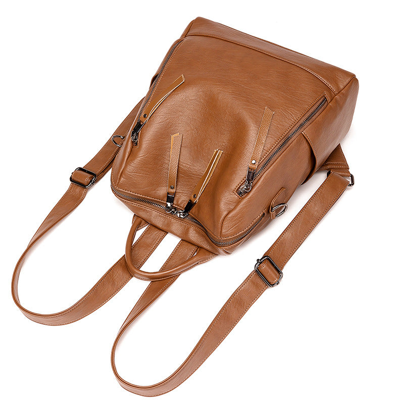 Mochila de cuero minimalista versátil e informal para mujer