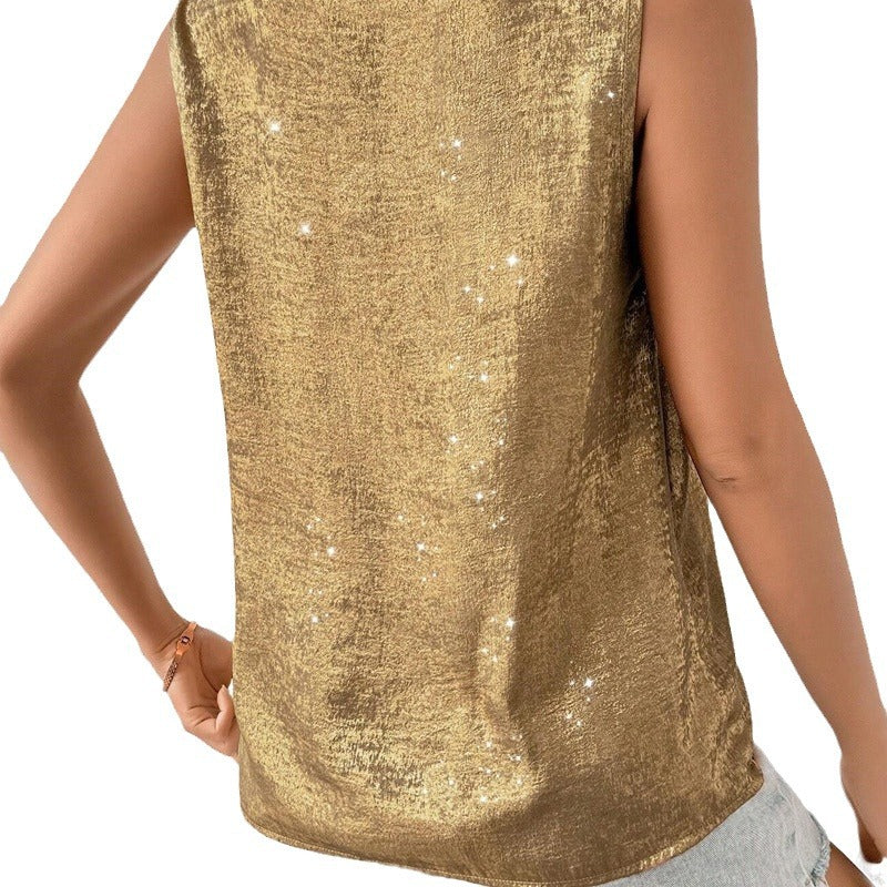 Gold sequin top worn by a person on a white background